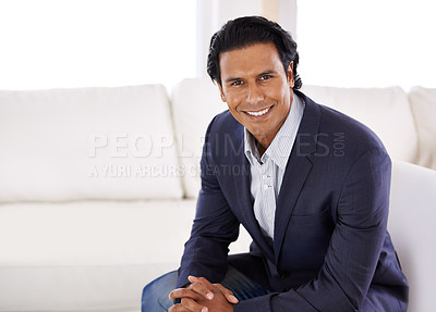 Buy stock photo A handsome young businessman in his home