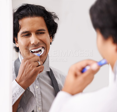 Buy stock photo Dental, mirror and man brushing teeth in a house for hygiene, beauty or morning routine before work. Teeth whitening, mouth and businessman with toothbrush in bathroom for tooth, cleaning or wellness