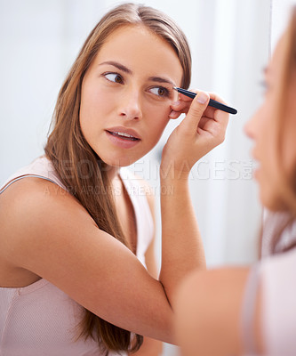 Buy stock photo Portrait, beauty and mascara with woman in bathroom of home for skincare, cosmetics or hygiene. Face, aesthetic and makeup routine with confident young person in apartment closeup for dermatology