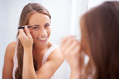 Buy stock photo Woman, tweezers and eyebrow in bathroom portrait for skincare, beauty or self care for face in mirror. Girl, facial hair removal or morning with cosmetic tools for brows, aesthetic or health in home