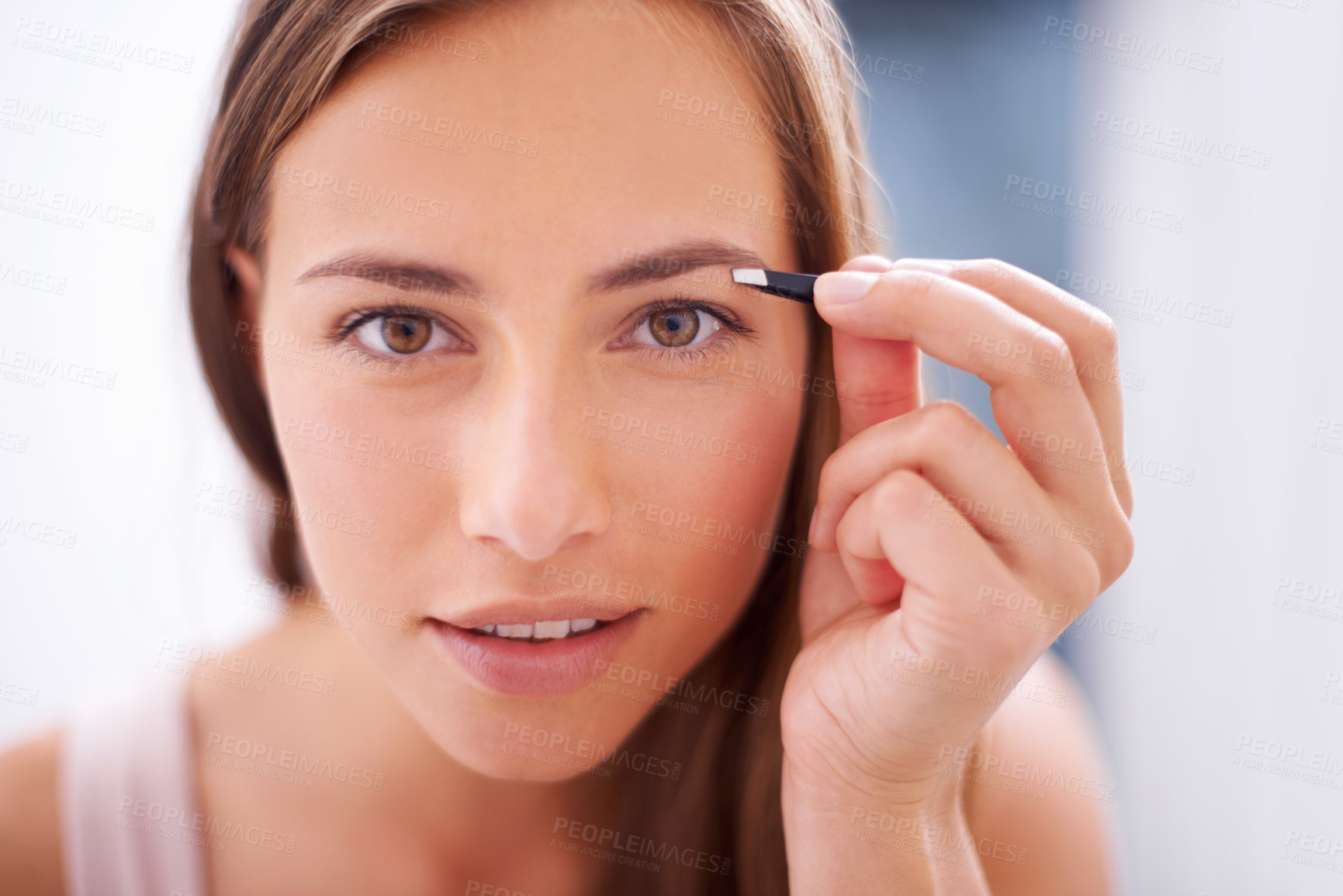 Buy stock photo Woman, tweezers and eyebrows in bathroom portrait for skincare, beauty or cosmetics for face in home. Girl, facial hair removal and cosmetic tools for brows, aesthetic or wellness in morning at house