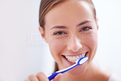 Buy stock photo Young woman, portrait and brushing teeth in bathroom with smile, health or self care for hygiene, grooming and routine. Girl, toothbrush and happiness for cleaning, healthy mouth and start morning