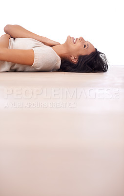 Buy stock photo Woman, happiness and relax on floor in home with mock up space, weekend break and confidence in apartment. Person, lying down and smile in house with wooden flooring for fun, leisure and freedom