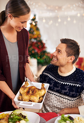 Buy stock photo Happy, Christmas and couple with dinner at party in dining room of modern home for celebration. Smile, festive and young man and woman with chicken and vegetables meal for xmas event at house.