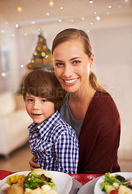 Buy stock photo Mother, child and portrait with Christmas dinner for celebration, smile and bond over festive season. Parent, kid and together with meal for celebration, xmas and holiday with food for family

