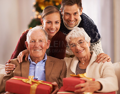 Buy stock photo Portrait of a happy family with gifts on Christmas day