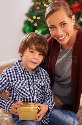 Buy stock photo Child, mother and portrait with Christmas present for festive season celebration for bonding, giving or holiday. Female person, boy and gift box in Canada at tree for vacation, happiness or package