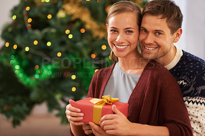 Buy stock photo Happy, Christmas gift and portrait of couple in living room at home for festive celebration. Smile, love and young man and woman with holiday present box for xmas event or party at modern house.