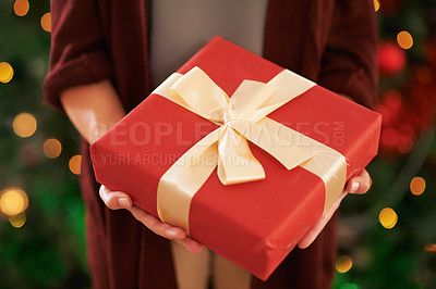Buy stock photo Hands, gift and Christmas box for festive season on holiday or present package for celebrate, party or decoration. Person, fingers and giving in Canada with ribbon or joyful vacation, bokeh or lights