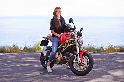 Buy stock photo Happy woman, portrait and biker on motorcycle by the ocean coast for road trip, travel or outdoor holiday in nature. Extreme female person with smile on ride for transport or sightseeing by the beach