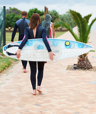 Buy stock photo Surfer, rear view and friends or walking outdoor with surfboard for adventure, vacation and holiday. Surfing, group and people with travel in nature for exercise, water sports and swimming in summer
