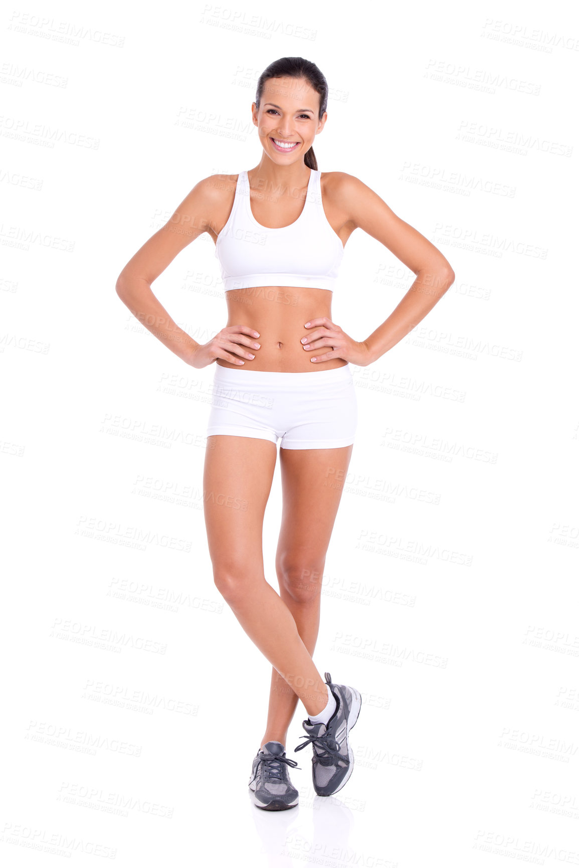 Buy stock photo Studio portrait of a fit young woman in exercise gear isolated on white