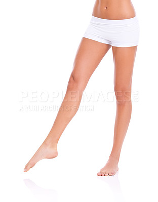 Buy stock photo Cropped studio shot of a woman's legs isolated on white
