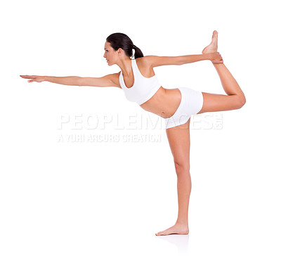 Buy stock photo Full length studio shot of a young in exercise clothing balancing on one leg isolated on white