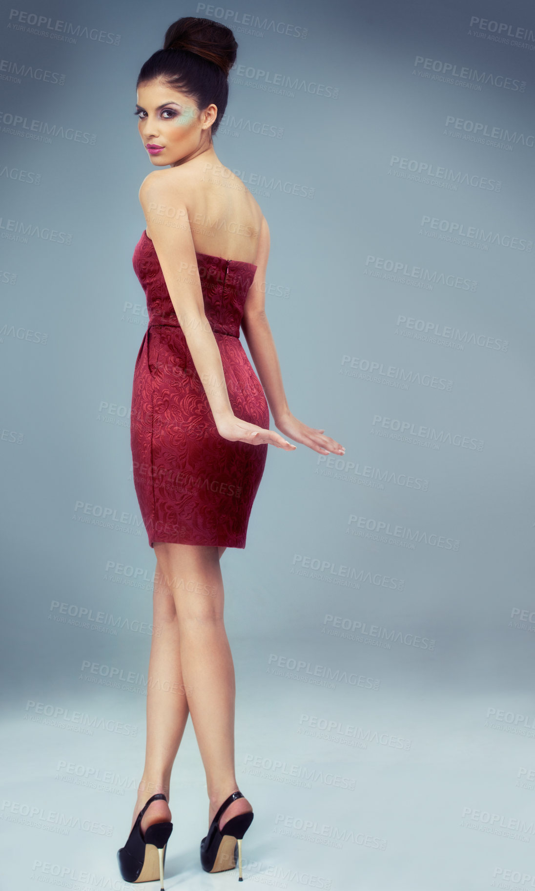 Buy stock photo Full-length portrait of a beautiful young woman wearing bold cosmetics