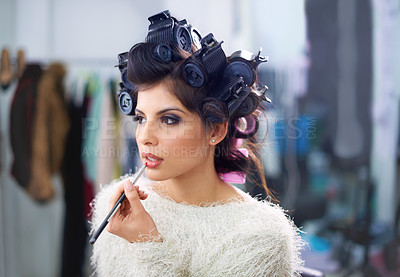 Buy stock photo Woman, face or hair curlers with lipstick for beauty in salon with haircare, self care or cosmetology. Model, person or cosmetics brush for morning routine or getting ready for wellness and grooming