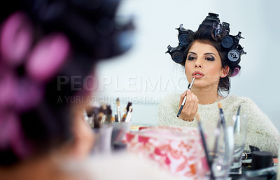 Buy stock photo Woman, face and hair curlers or lipstick for beauty in mirror and haircare, self care or cosmetology. Model, person or hairstyle for morning routine, curling or getting ready for wellness or grooming