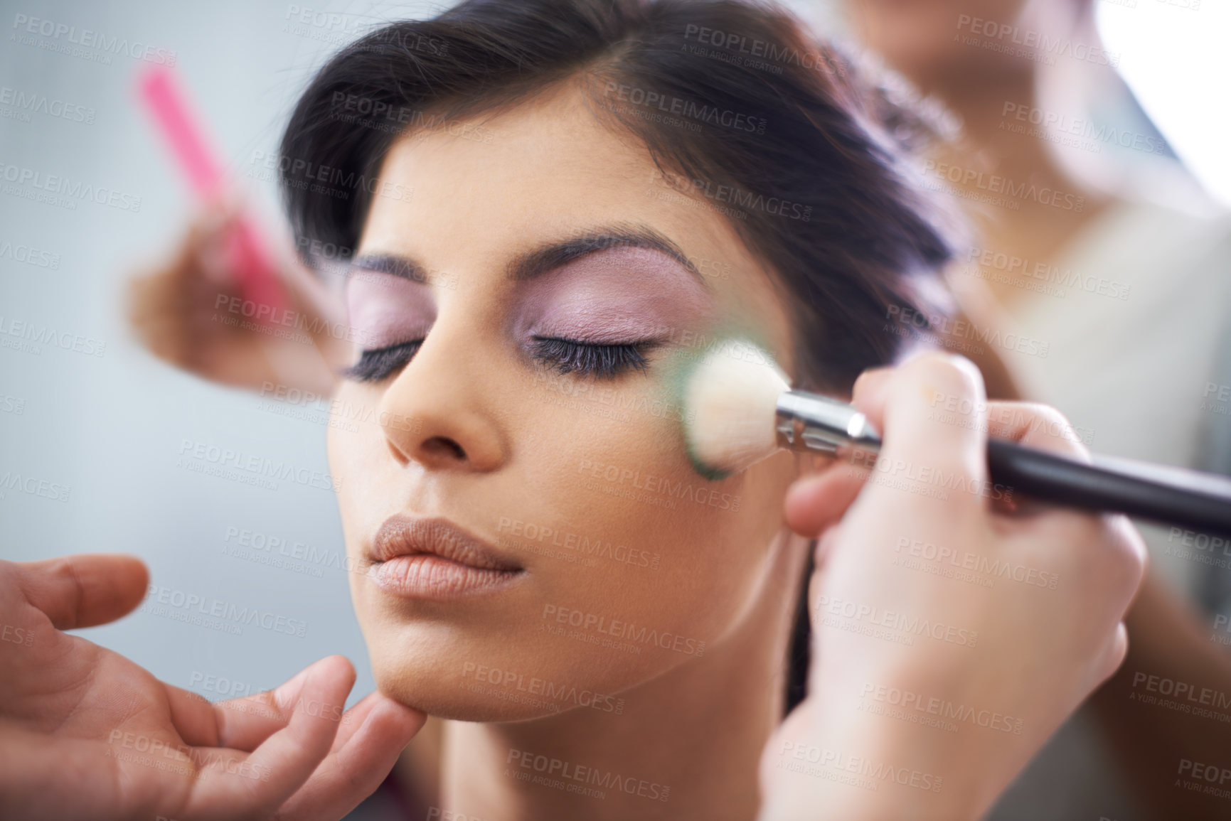 Buy stock photo Face, hands and woman with makeup application and beauty, brush for color powder and glamour with beautician. Eyeshadow, lashes for cosmetology and cosmetic care with people backstage for styling