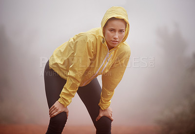 Buy stock photo Winter, portrait and tired fitness woman in nature for training, wellness or cardio in the rain. Sports, face and fatigue by female runner in forest for breathing, break or recovery from workout run