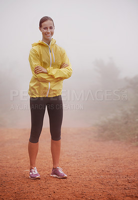 Buy stock photo Woman, portrait and arms crossed for fitness in forest with fog for exercise, morning routine and workout with smile. Athlete, face and person or happy on outdoor trail for wellness and healthy body