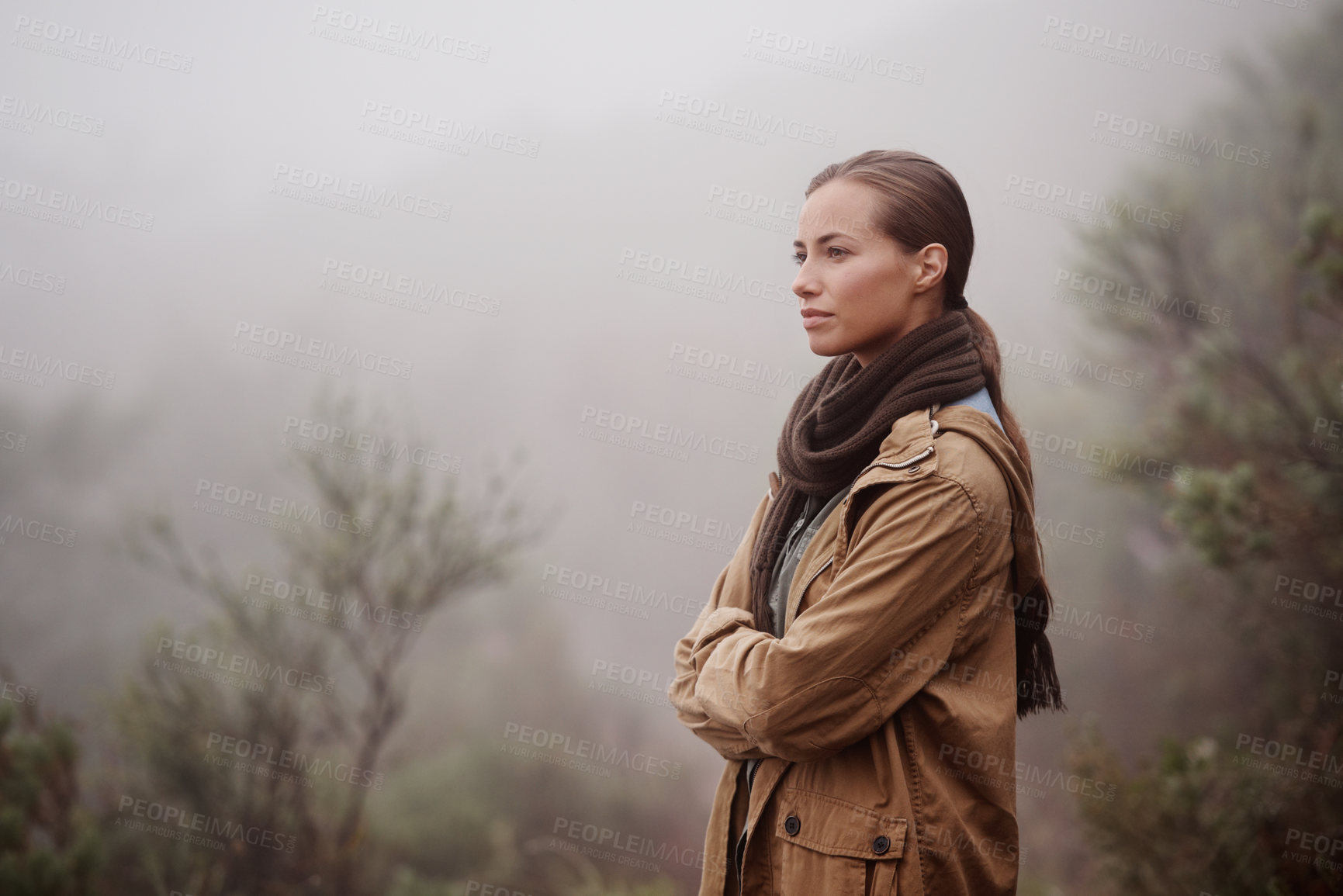 Buy stock photo An attractive young woman out for a walk in the mountains