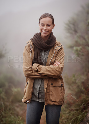 Buy stock photo Hiking, portrait and happy woman with arms crossed in nature for travel, wellness or walk outdoor in winter. Face, pride hiker in a forest for fresh air, camping or adventure, journey or campsite fun