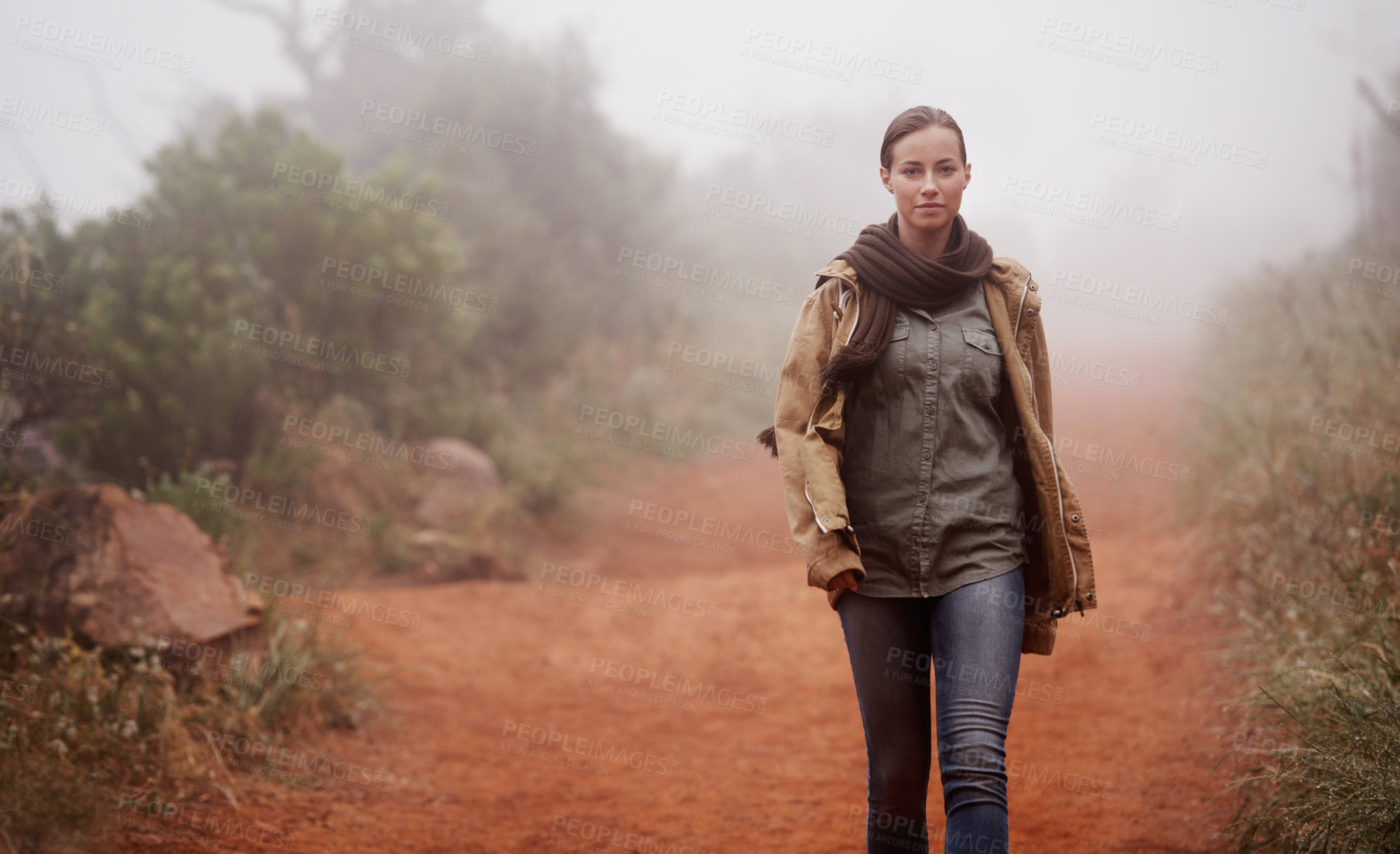 Buy stock photo An attractive young woman out for a walk in the mountains