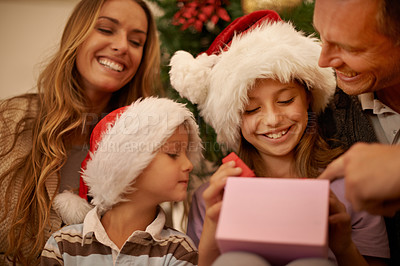 Buy stock photo A little girl receiving a Christmas present