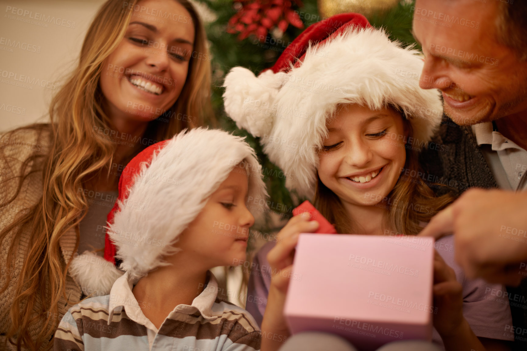 Buy stock photo A little girl receiving a Christmas present