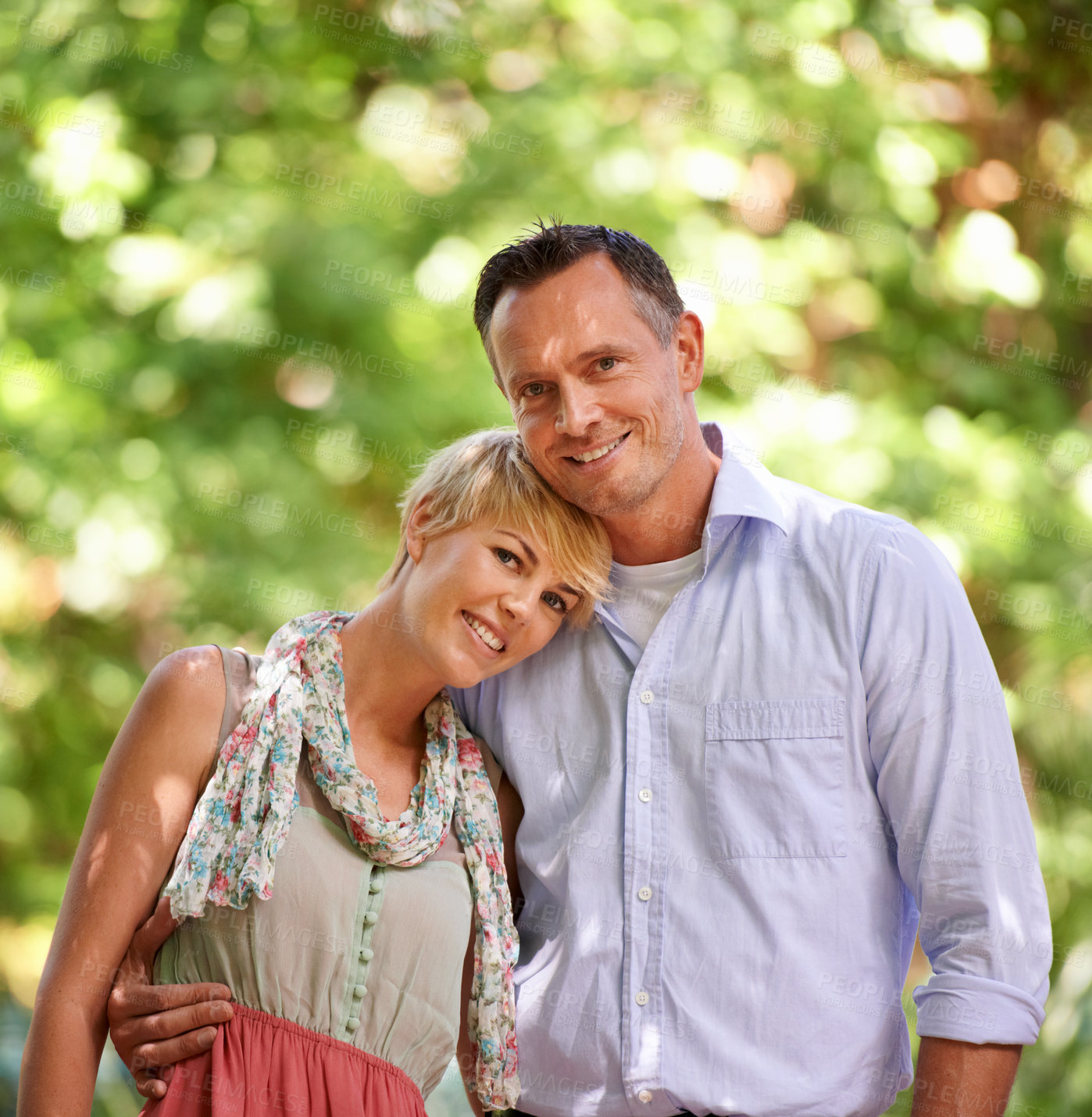 Buy stock photo Love, portrait and happy couple hug in a park for travel, adventure or bonding in nature together. Face, romance or people embrace in forest for summer date, reunion or weekend, holiday or vacation