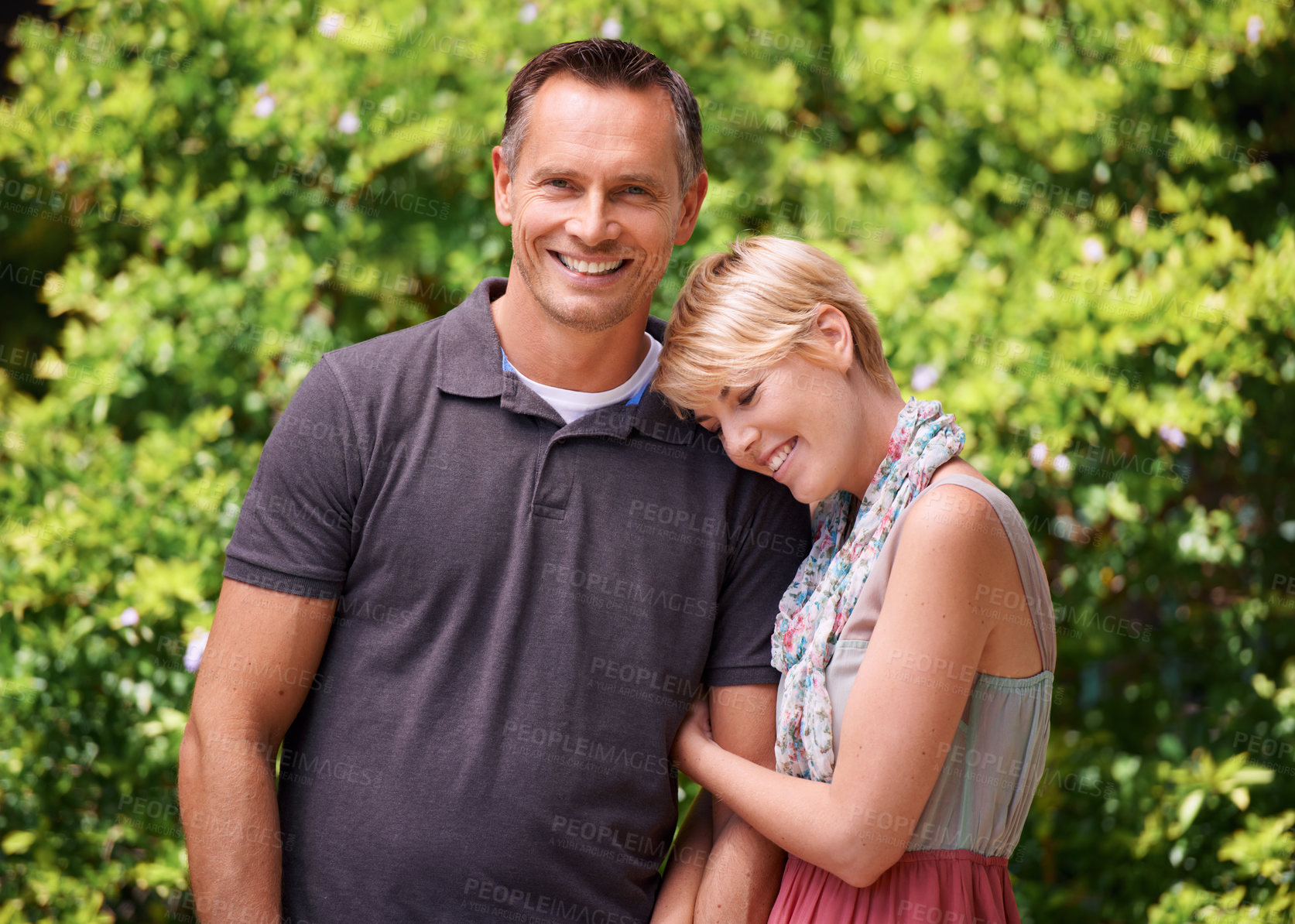 Buy stock photo Love, hug and happy couple in a park for travel, adventure and bonding in nature together. Smile, romance and people embrace in a forest for summer date, reunion or weekend, holiday or fun vacation