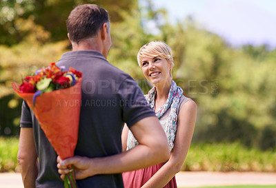 Buy stock photo Surprise, happy couple and gift of flowers outdoor in nature, bonding or date on valentines day. Bouquet, man and woman with present for love, care or romantic connection of people at garden together