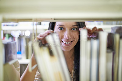 Buy stock photo Portrait of a young female college student in a library