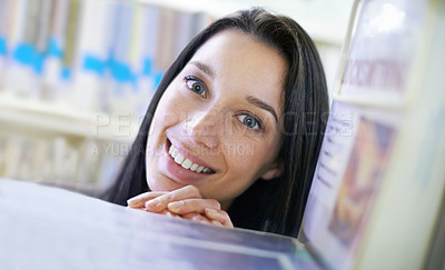Buy stock photo Happy, student and portrait of woman in library for studying at university for test, exam or assignment. Smile, education and confident young female person by books at college campus or academy.
