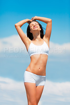 Buy stock photo Blue sky, young woman happy and body stretching in underwear for self love. Female person smiling for freedom or carefree, body care or health wellness of model in lingerie for skincare outdoors