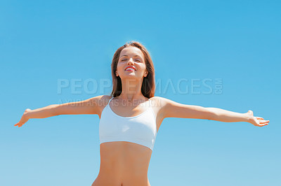 Buy stock photo Sky, smile and stretching arms and woman in underwear for fitness, freedom and health goals achievement. Mockup, happiness and model with sunshine, healthy mindset and celebration on blue background.