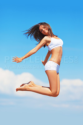 Buy stock photo Energy, happy woman and jumping in the air on a blue sky for freedom, summer body and happiness. Smile, excited jump and a girl in underwear for comfort, free and positivity with a boost in vitality