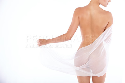 Buy stock photo Rearview shot of a nude woman draped in see-through gauze isolated on white