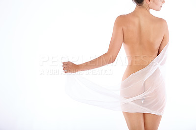 Buy stock photo Rearview shot of a nude woman draped in see-through gauze isolated on white