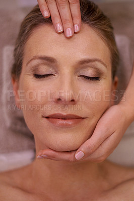 Buy stock photo Cropped shot of a woman in a day spa getting a face massage