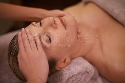 Buy stock photo Cropped shot of a woman in a day spa getting a face massage