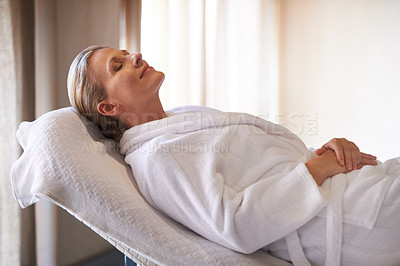 Buy stock photo Woman, calm and smile for wellness, spa and healthy weekend getaway at luxury retreat in Amsterdam. Peaceful, holistic and female person for rest on table with robe, eyes closed and happiness