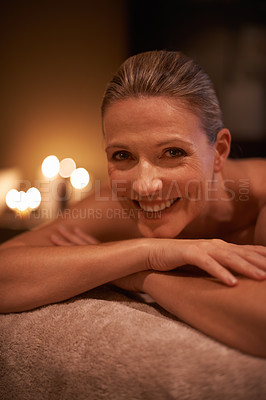 Buy stock photo Female person, smile and spa for wellness, relax and self care and massage on table being happy. Woman, body treatment and portrait to destress, peace and detox for calm and holistic relaxation