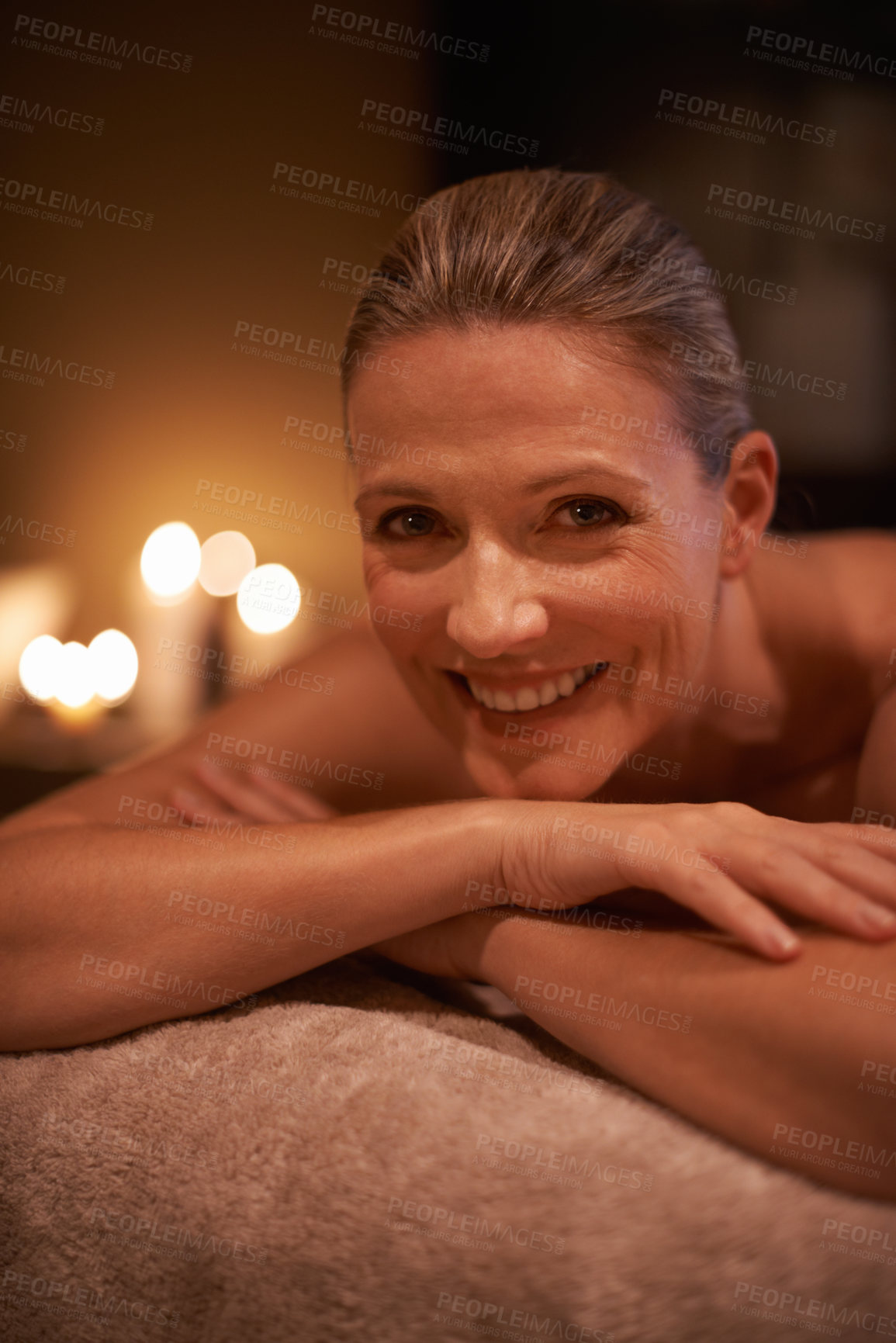 Buy stock photo Female person, smile and spa for wellness, relax and self care and massage on table being happy. Woman, body treatment and portrait to destress, peace and detox for calm and holistic relaxation
