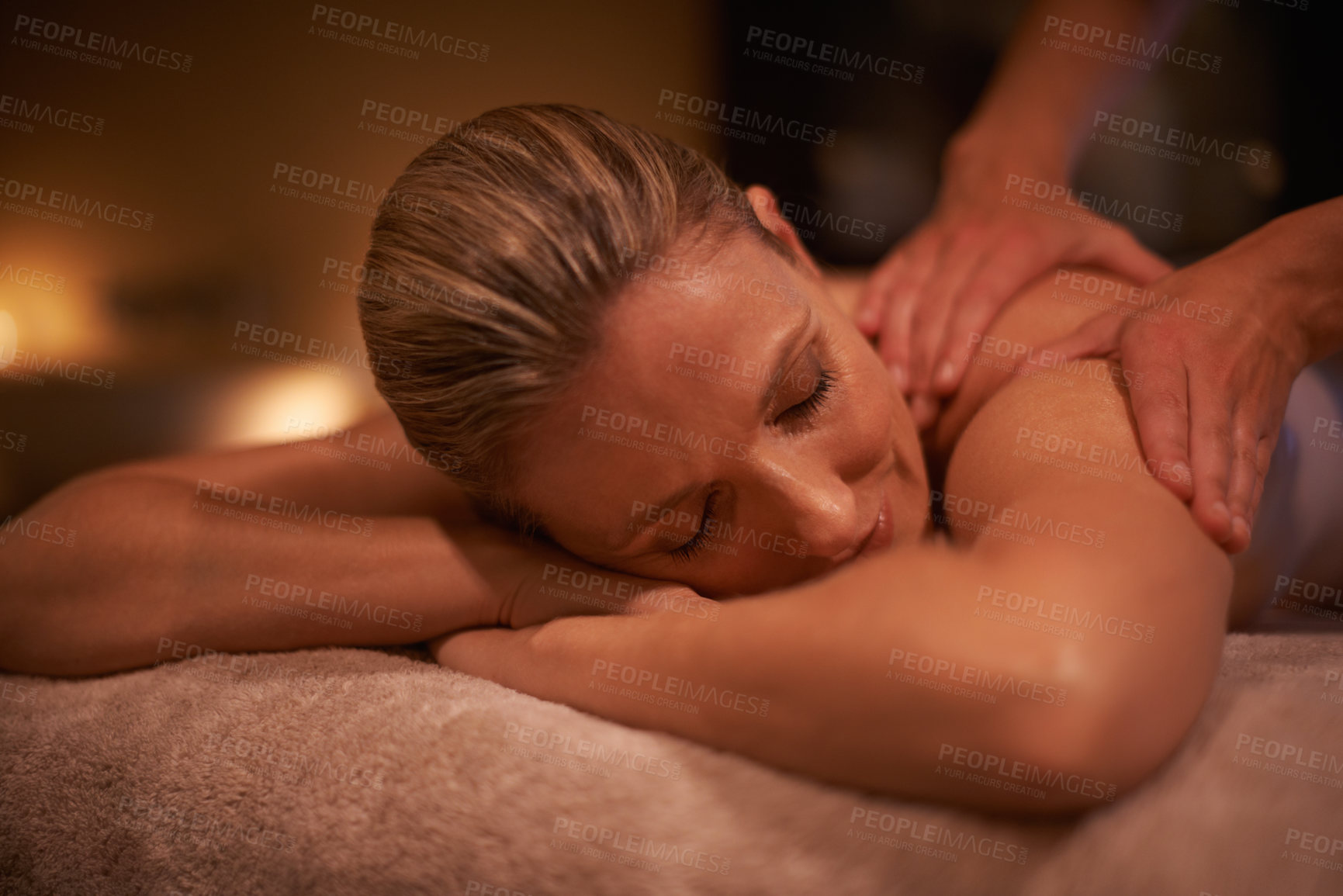 Buy stock photo Cropped shot of a woman in a day spa getting a massage