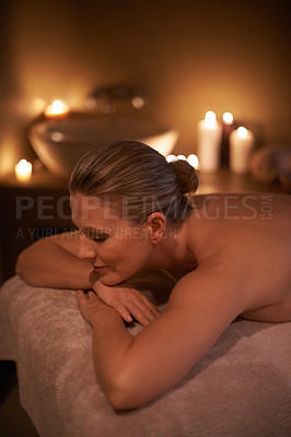 Buy stock photo Massage, relax and woman with holiday, spa and stress relief with hospitality industry and weekend break. Person, customer and girl on a table and wellness with beauty and happy with detox or candles