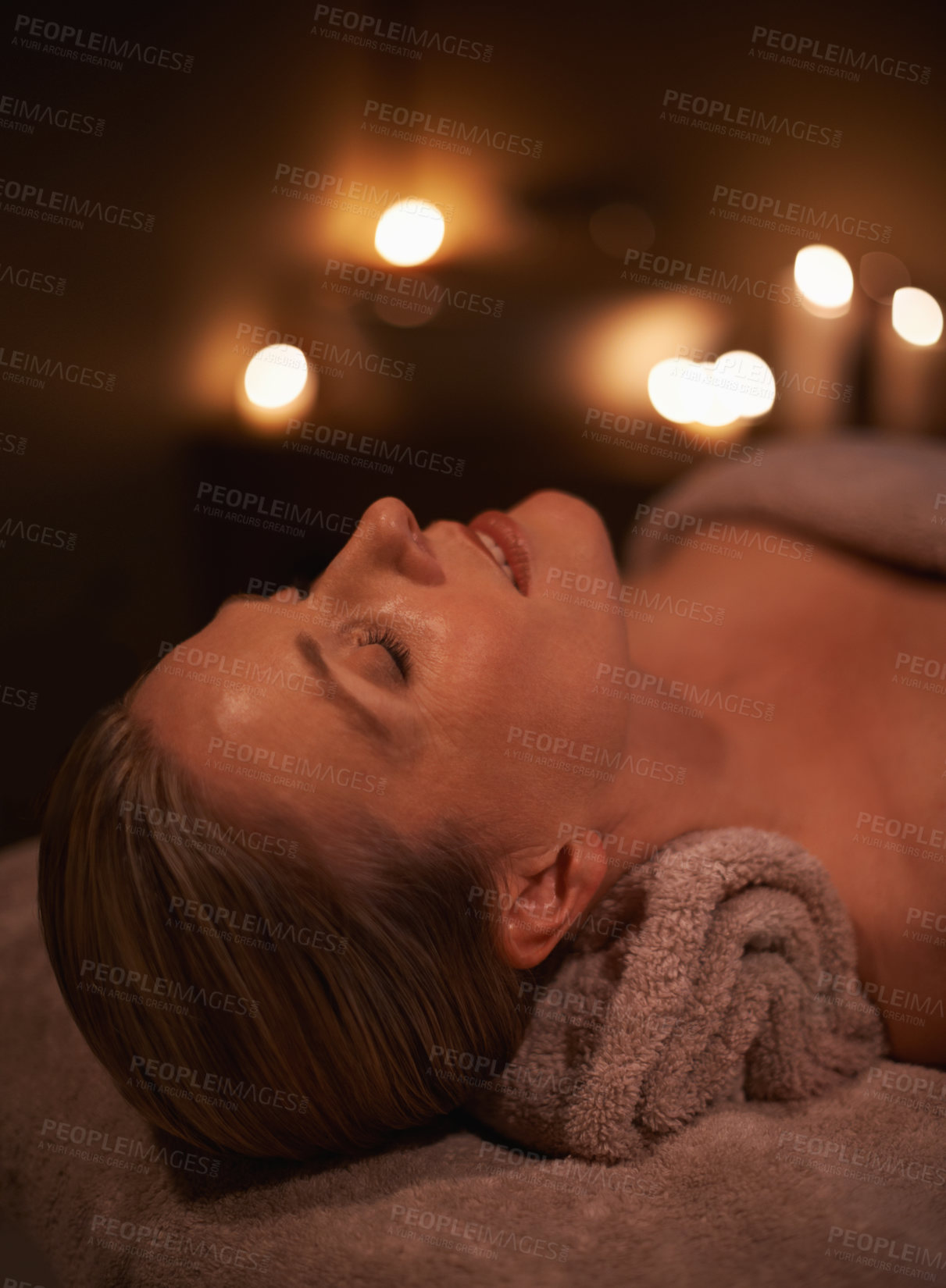 Buy stock photo Face massage, spa and wellness with woman, luxury and candle with hospitality and peace. Person, facial and girl with stress relief or healthy with vacation or beauty with holiday, detox or self care