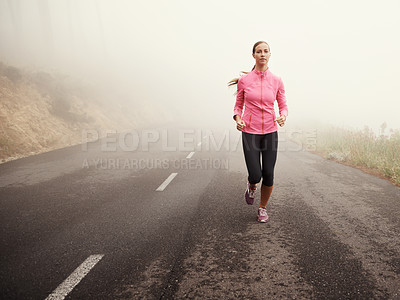 Buy stock photo Nature, sports and young woman running on mountain road for race, marathon or competition training. Fitness, exercise and energy with female athlete with cardio workout in outdoor, fog and health