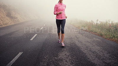 Buy stock photo Running, legs and woman on road outdoor in forest, park or woods for exercise in winter. Morning, fog and person with fitness training and healthy workout on path in mountain countryside with nature