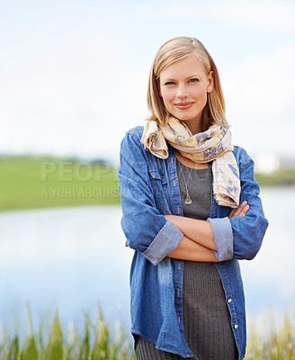Buy stock photo Shot of a casual, attractive blonde woman standing  outdoors